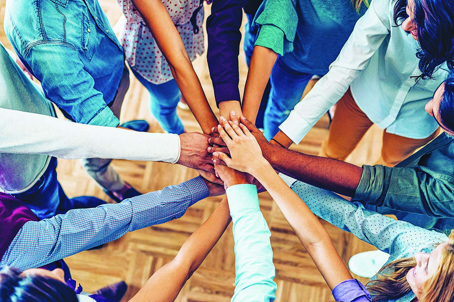 People joining together in a circle